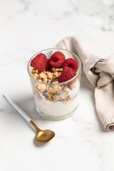 yogurt with granola and raspberries