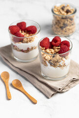 yogurt with granola and raspberries