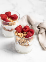 yogurt with granola and raspberries