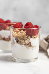 yogurt with granola and raspberries