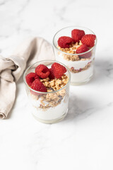 yogurt with granola and raspberries