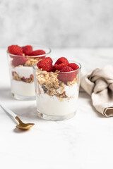 yogurt with granola and raspberries