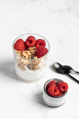 yogurt with granola and raspberries, breakfast