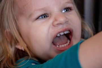 Beautiful and healthy baby teeth in a little girl. The baby's mouth with a milk tooth