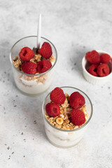yogurt with granola and raspberries
