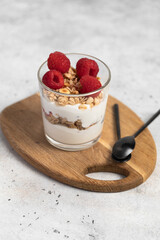 yogurt with granola and raspberries, breakfast