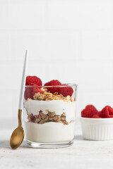 yogurt with granola and raspberries, breakfast