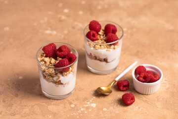 yogurt with granola and raspberries, breakfast