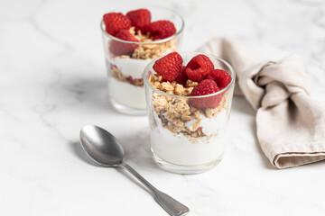 yogurt with granola and raspberries, breakfast