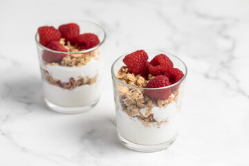 yogurt with granola and raspberries, breakfast