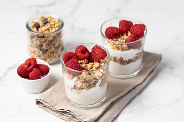 yogurt with granola and raspberries, breakfast