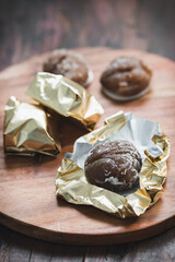 Close-Up of Candied Chestnuts (Marron Glacé) on Wooden Surface – Traditional Sweet