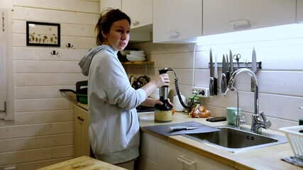 Preparing a simple meal in a cozy kitchen with a blender and fresh ingredients