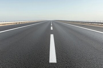 Endless highway stretches into horizon, smooth asphalt and clear