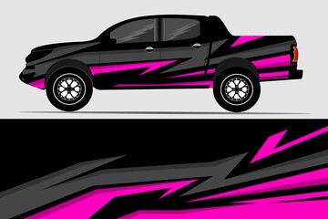 Black and pink pickup truck with dynamic graphic design parked against a neutral background