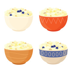 Collection of ceramic bowls with various designs with oatmeal, cornmeal porridge with banana and blueberry
