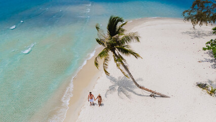 This aerial photo of Koh Kood Island Thailand showcases its beautiful beach with crystalclear...