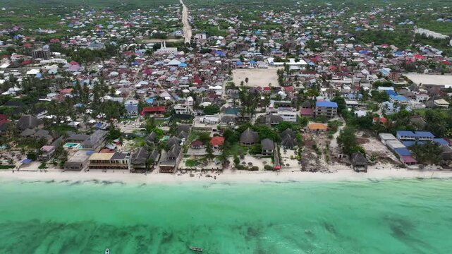 Paje, Zanzibar, Tanzania, 4k aerial video footage flying from Paje beach to downtown - located on island of Unguja - with countryside landscape and road construction site in background 