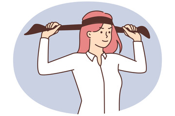 Woman ties black headband around head to show seriousness or professionalism