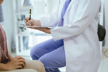 Doctor analyzes patient's blood test results and medication use on health screening concept chart.
