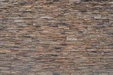 Concrete facade stone in beige and brown color.
