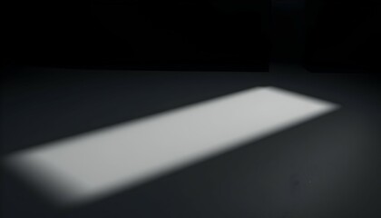 Rectangle of Light Illuminating Dark Surface Creating Dramatic Minimalist Scene