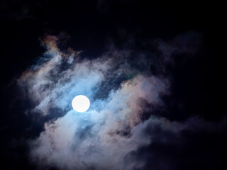 Obraz premium Strong Moonlight Pierces Through Clouds