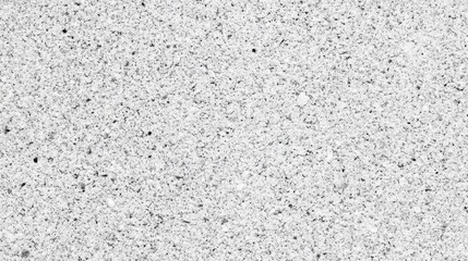 Obraz premium Surface texture featuring a variety of small stones and particles in a neutral tone across a flat background