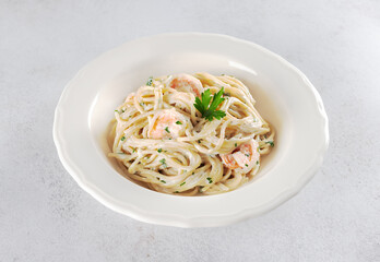 Italian shrimp pasta on white background. Italian food.