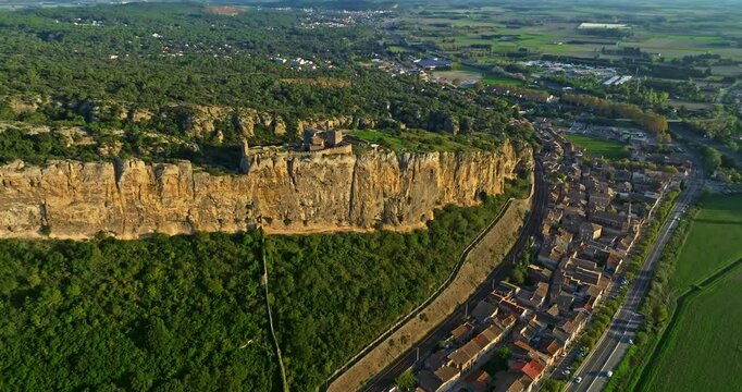 Mornas Fortress stands majestically on top of a rocky cliff. The Fortress of Mornas is a medieval fortress above the village of the same name in the French department of Vaucluse
