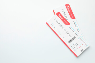 Travel agency. Flight tickets on light background, top view. Space for text