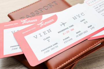 Travel agency. Flight tickets and passports on wooden table, closeup