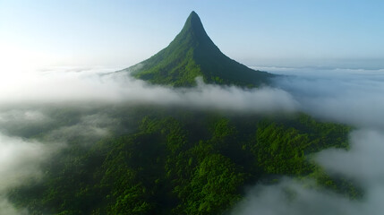 Lush Green Mountain Peak Above Cloudscape