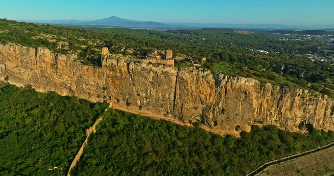 Mornas Fortress stands majestically on top of a rocky cliff. The Fortress of Mornas is a medieval fortress above the village of the same name in the French department of Vaucluse