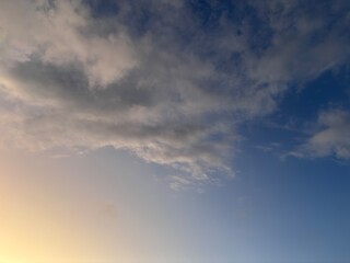 Beautiful sky with natural gradations. Thick clouds in the dusk sky on a winter night. Image of a cloudy sky in the afternoon. View of the night sky with golden light from the evening sun