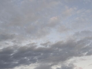 Beautiful sky with natural gradations. Thick clouds in the dusk sky on a winter night. Image of a cloudy sky in the afternoon. View of the night sky with golden light from the evening sun