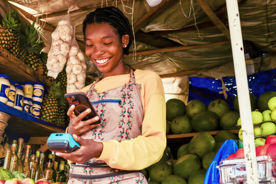 excited young sales person accepting digital payment of clients