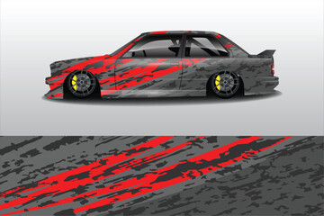 Stylishly Modified Car with Bold Red and Gray Camouflage Design, Set Against a Minimalist Background