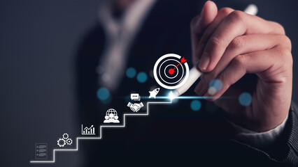 Business Growth Strategy overcoming Challenges to Achieve Market Success and pen write Target Goals planning, increased performance, and strategic achievement for long-term success.