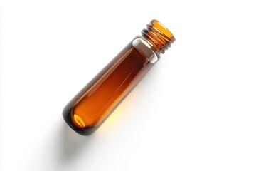 Fototapeta premium Amber glass bottle filled with essential oil photographed against a white background showcasing its
