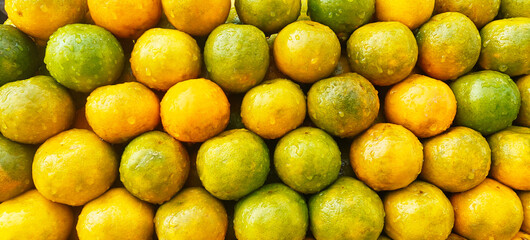 A pile of fresh oranges open sell in Indian market.