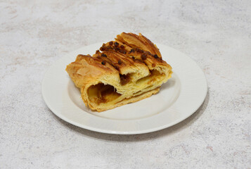 Delicious cinnamon danish pastry on a white plate