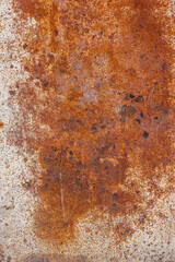 rusty flat sheet steel with peeled-off white paint leftovers