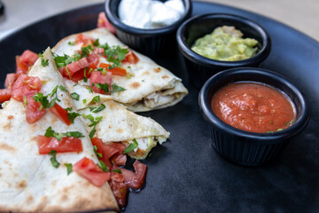 Delicious Quesadilla with Salsa, Guacamole, and Sour Cream