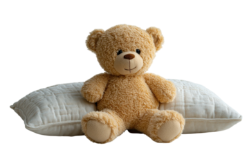 Adorable teddy bear sitting on a soft cream pillow a peaceful scene with neutral tones and soft