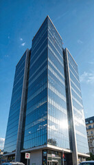 Fototapeta premium Modern Glass Office Building Exterior Corporate Skyscraper Architecture Cityscape Sunny Day