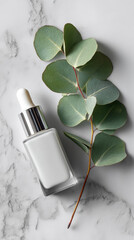 A minimal scene featuring a single white serum bottle beside a eucalyptus leaf on a marble surface highlighting simplicity and elegance