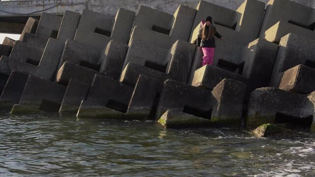 The child stands on tetrapods