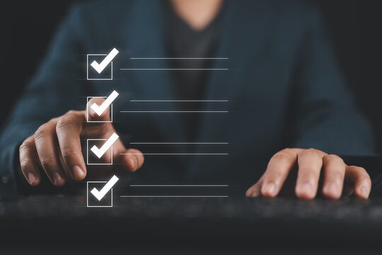 Quality control and check list, Businessman touch to tick correct sign mark in checkbox for quality document control checklist and business approve project concept.