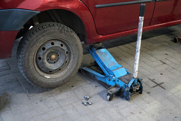 A car at a car service center repairs a wheel